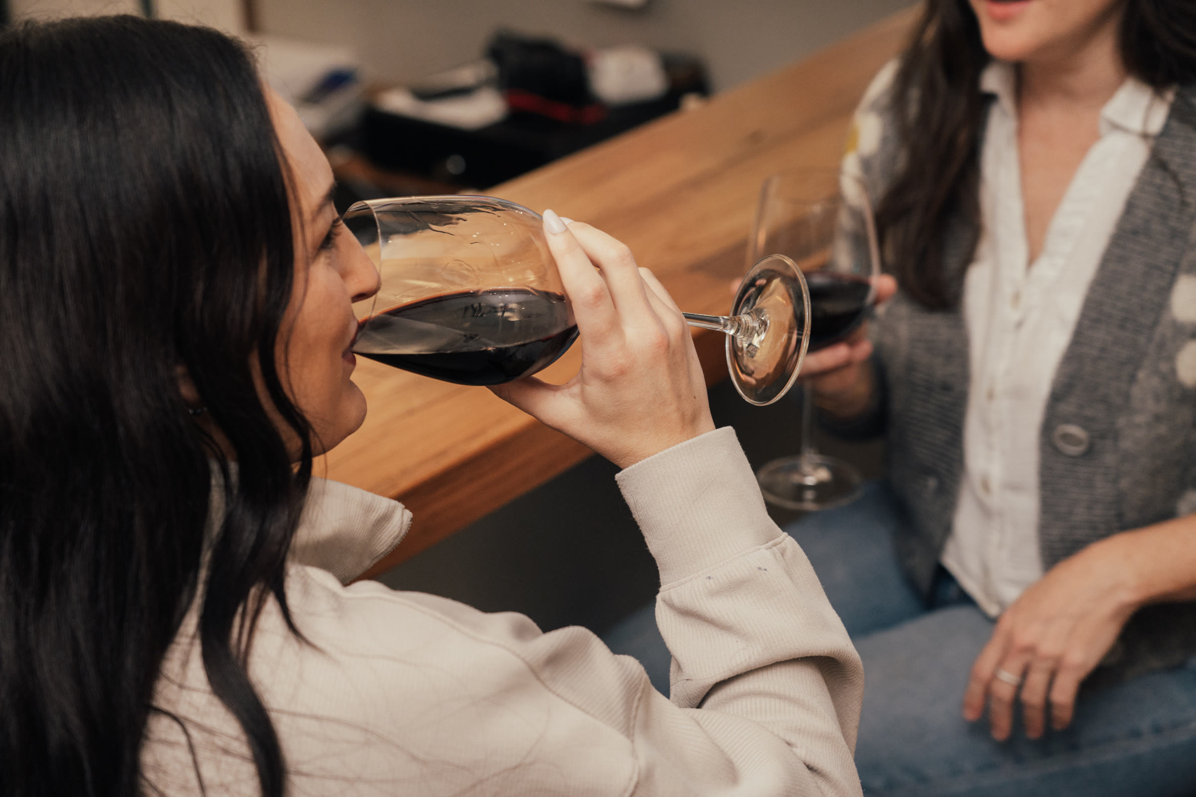 Adults relaxing over a glass of Napa Valley wine